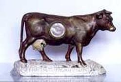 Cow figural advertising clock — Antique Clocks Price Guide