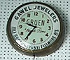 Electric advertising clock sign for "Gawel Jewelers 1112 Broadway-531 Fillmore Ave, Greun Watch Time".