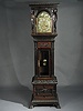 OUTSTANDING WALTER H. DURFEE TALL CLOCK WITH OUTRAGEOUS CARVING TO CASE