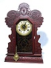 Ingraham "Gila" pressed oak kitchen clock.