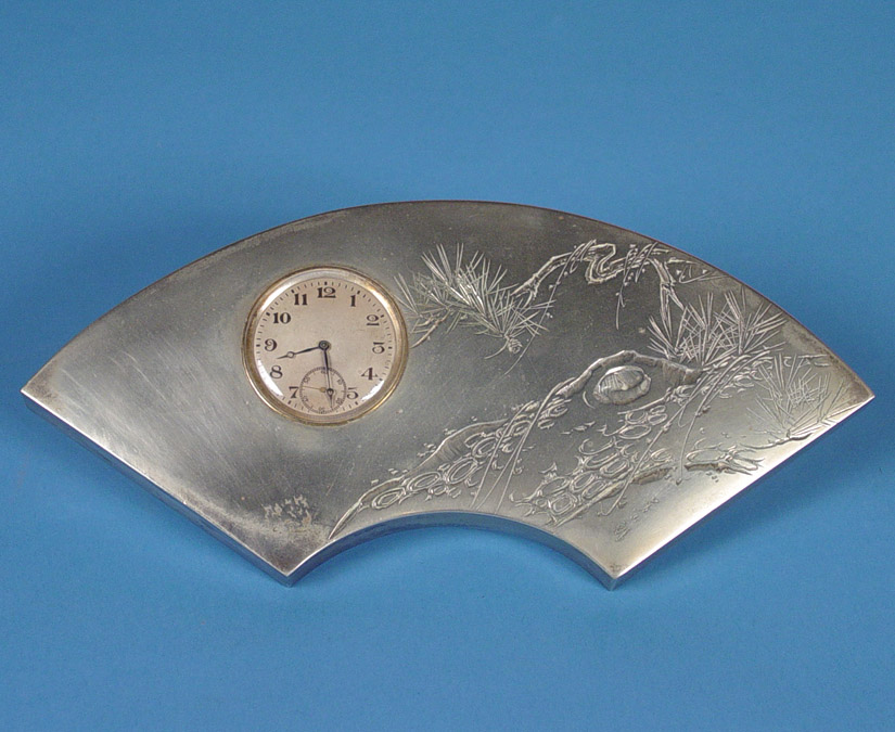 Far Eastern Silvered Art Deco Oriental Strut Clock, — Antique Clocks Price Guide