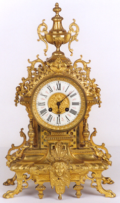 A FRENCH GILT BRONZE SHELF CLOCK, the Louis XV style ornate case — Antique Clocks Price Guide