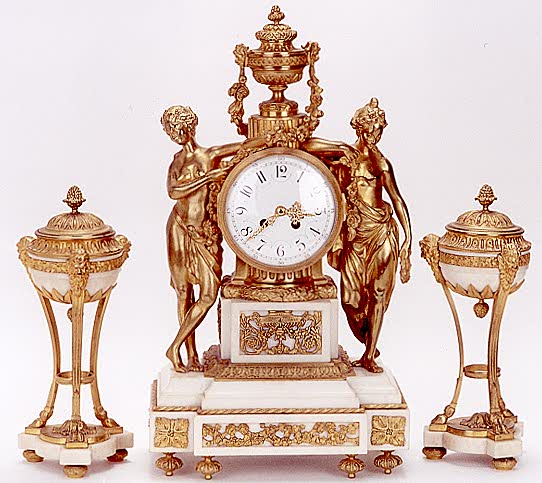 A FRENCH DIRECTOIRE THREE PIECE FIGURAL CLOCK SET: — Antique Clocks Price Guide