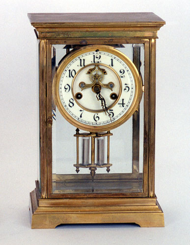 A WATERBURY BRASS CASED MANTEL CLOCK — Antique Clocks Price Guide
