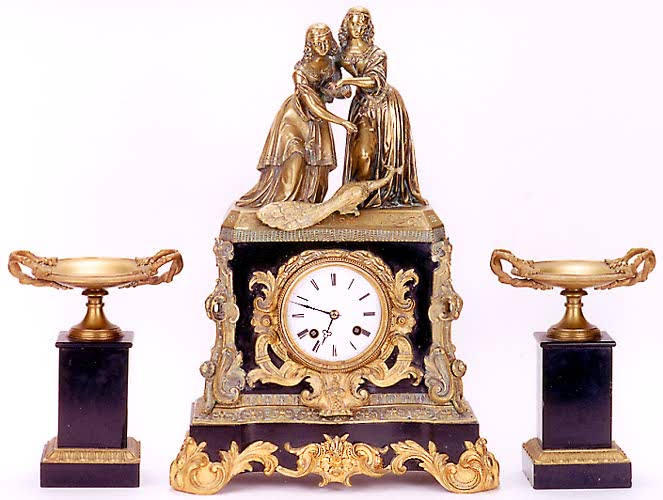 THREE-PIECE ORMOLU AND BLACK SLATE STATUE CLOCK SET, French, early 19th century, — Antique Clocks Price Guide