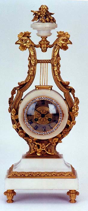 A FRENCH GILT BRONZE AND MARBLE LYRE CLOCK, late 19th century. — Antique Clocks Price Guide