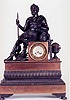 CHARLES X EMPIRE STYLE PATINATED BRONZE AND COPPER STATUE CLOCK, French, dated 1827,