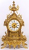 A FRENCH GILT BRONZE SHELF CLOCK, the Louis XV style ornate case