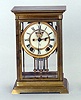 AN ANSONIA BRASS CASED MANTLE CLOCK