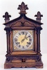 A GERMAN MANTEL CLOCK.