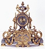 A FRENCH GILT BRONZE AND MARBLE MANTEL CLOCK.