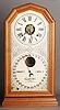 ITHACA CALENDAR SHELF CLOCK, Model No. 11, octagon "Poni", eight day time and strike movement with alarm,