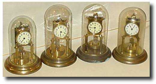 4 various torsion clocks. — Antique Clocks Price Guide