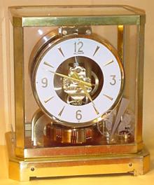 Atmos II circa 1950. Interesting item with engraving on the dial in which a 1924 US Dollar is being split by a blade. — Antique Clocks Price Guide