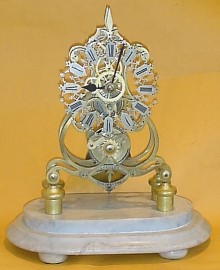 Skeleton in scroll frame by Smith's of Clerkenwell — Antique Clocks Price Guide