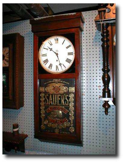 New Haven Clock Co. Advertising Wall Clock, Sauers Extracts, circa 1890 — Antique Clocks Price Guide