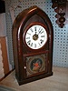 Mahogany Veneered beehive mantle clock with the Canadian Crest on door glass.