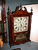 30-HOUR WOOD WORKS PILLAR AND SCROLL MANTLE CLOCK.