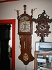 30 hour Dutch wall clock with figures on hood.