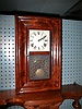 Miniature eight-day shelf clock with strike on the hours.