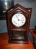 Peaked roof shelf clock by the New Haven Clock Company, New Haven, Connecticut.