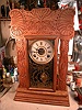 Oak, eight-day 'kitchen clock' with fancy wood and door glass.