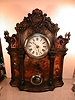 Iron front clock with eight-day mechanism and hourly strike.