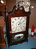 Pillar and scroll 30-hour wooden works mantle clock.