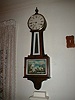 New Haven Clock Company  WARING  eight-day wall banjo clock with hourly chime.