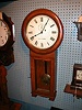SETH THOMAS No. 2 wall regulator. Round top solid Oak case with painted original dial; brass weight.