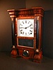 Eight-day Seth Thomas mantle clock, c. 1864,  with bold graining and "ST" hands.