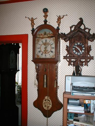 30 hour Dutch wall clock with figures on hood. — Antique Clocks Price Guide
