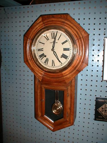 Walnut finished pine case eight-day "Schoolhouse" clock with strike on the hours. — Antique Clocks Price Guide