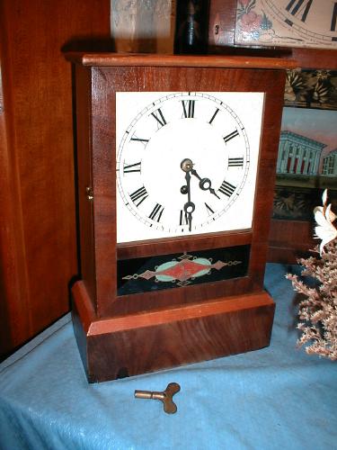 Flat top 'cottage clock' with reverse-painted lower door glass — Antique Clocks Price Guide