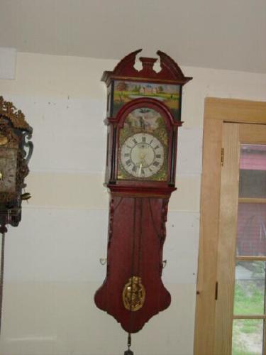 Double hooded Dutch 'tail clock' with animation on dial. — Antique Clocks Price Guide