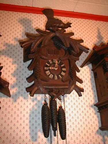 Cuckoo and Quail wall clock with carved Pine Cones. — Antique Clocks Price Guide