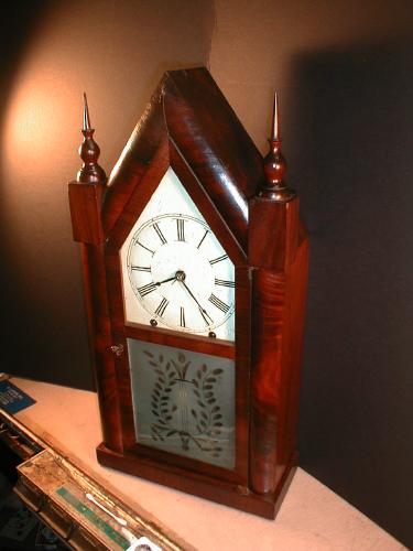 8-day steeple clock with etched pattern on lower door glass. — Antique Clocks Price Guide