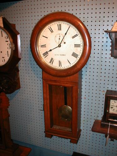 SETH THOMAS No. 2 wall regulator. Round top solid Oak case with painted original dial; brass weight. — Antique Clocks Price Guide