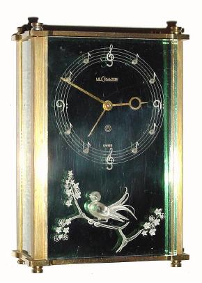 C.1960, LeCoultre, 8-day, novelty alarm timepiece. This little alarm plays a small spring music box inside. The case houses a jeweled escapement watch like movement. — Antique Clocks Price Guide