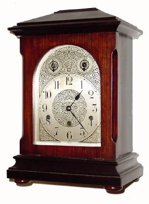C.1905, German, 3-train Westminster Chime mantel clock, mahogany case with embossed arched dial and small dials for chime/ silent and fast/ slow. — Antique Clocks Price Guide