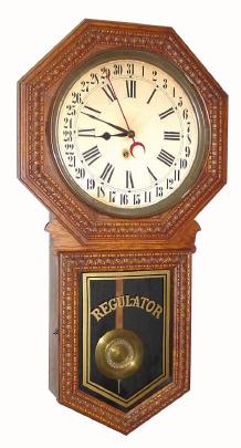 C.1911 E. Ingraham Co., ÒHartfordÓ, 8-day pressed oak calendar timepiece, long drop octagon. — Antique Clocks Price Guide