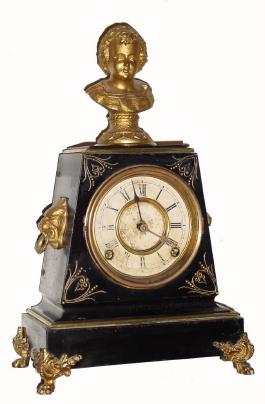 C.1880, H. J. Davies, New York, Figural clock of Mozart as a boy, black iron case with white metal trim. — Antique Clocks Price Guide