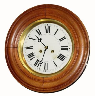 C.1910, German for the French market, round walnut gallery clock, some call this a bakerÕs clock since most French bakeries seem to have them. — Antique Clocks Price Guide