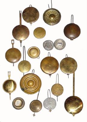 Box lot of 18 assorted US and foreign shelf clock pendulums/bobs as found; — Antique Clocks Price Guide
