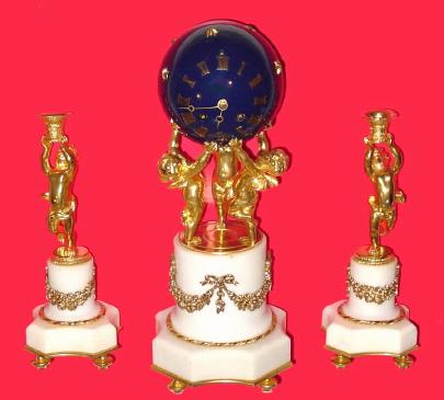 C.1880 French, 8-Day, 3-Cherubs, ormolu and marble mantel clock ÓSETÒ, the cherubs holding aloft a dark blue globe containing the time and bell strike ÓPENDULUMÒ movement, and with matching garnitures. — Antique Clocks Price Guide