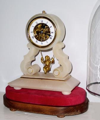 C.1890, French, ÒSwinging Doll Under DomeÓ, soft white alabaster case with gilt trim. — Antique Clocks Price Guide