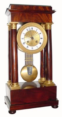 C.1875, French, 4-Column Empire clock in crotch mahogany, 8-day time and strike. — Antique Clocks Price Guide