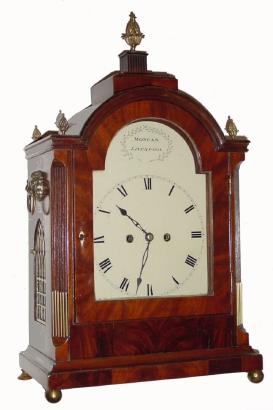 C.1820, English, Moncas Ó(J)Ò, Liverpool, 2-fusee bracket clock, mahogany case with brass inlaid stop fluted pilasters, gilt brass lion head ring pulls and gothic style pierced brass sound frets, brass ball feet and pineapple finials. — Antique Clocks Price Guide