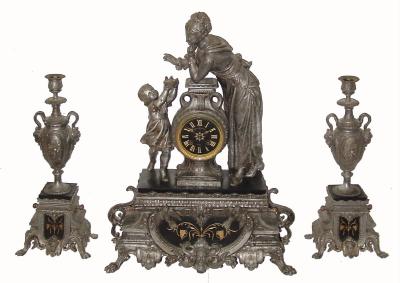 C.1890, French, Spelter and Marble mantel set, Fortuna and child with a basket containing 3 chicks, the sidepieces with matching insets of Belgian slate with gilt incising. Dial with retailer: Daenen Lubrun, Huy. — Antique Clocks Price Guide