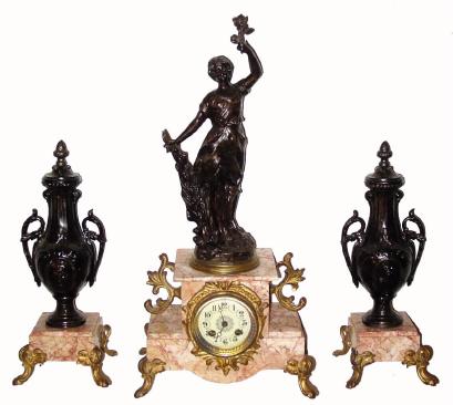 C.1890, French, 3-Piece Mantel Garniture clock set, patinated spelter, titled ÒLes RosesÓ, with 8-day time and strike movement; lady holds a single rose, and with roses on the urns. — Antique Clocks Price Guide
